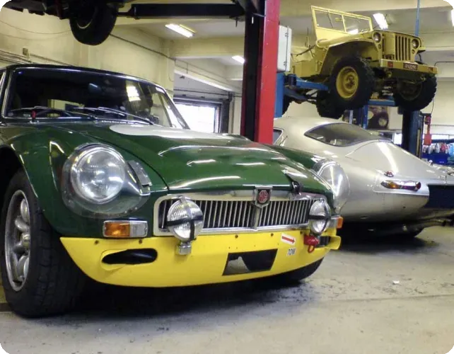 Classic car raised on workshop ramp at Beacon Hill Garage